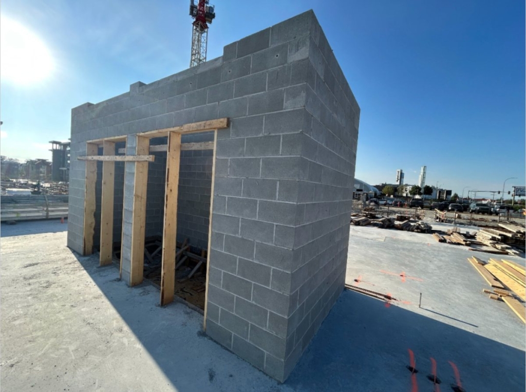 Building 4 elevator core block wall rising above the slab